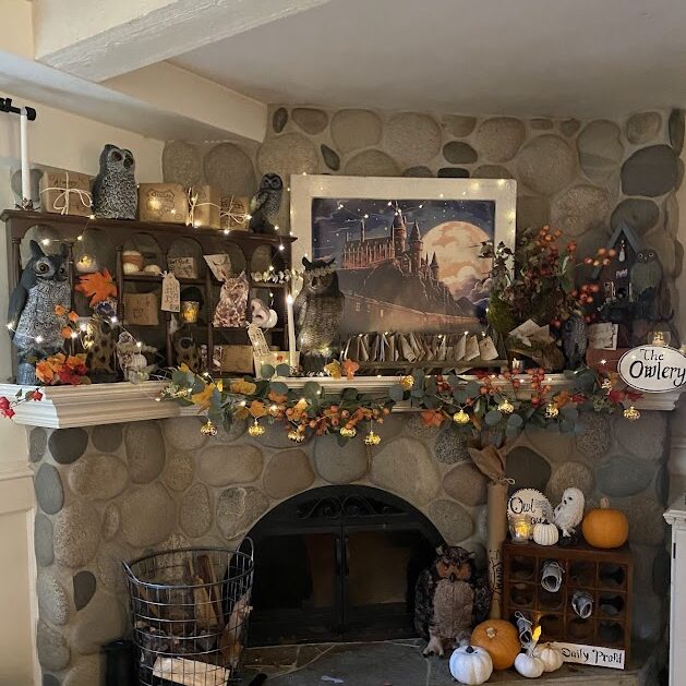 The Owlery from Harry Potter with owls, letters, scrolls, branches, Hogwarts picture, and pumpkins. a cozy spot for a Harry Potter party